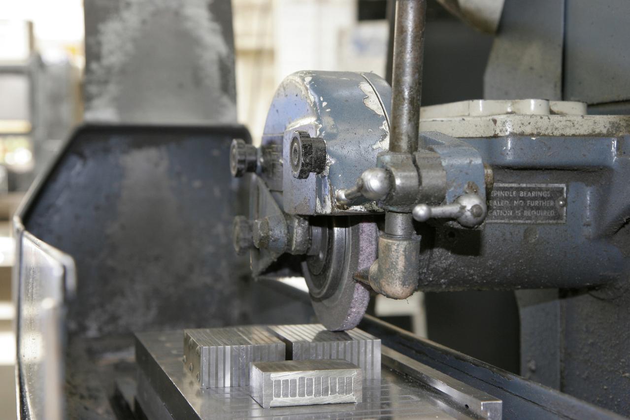 Auto component deburring abrasive application